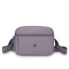 A mauve nylon crossbody bag with a zipper and adjustable strap is shown against a white background.