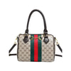 A beige and green patterned leather tote bag with a brown strap.