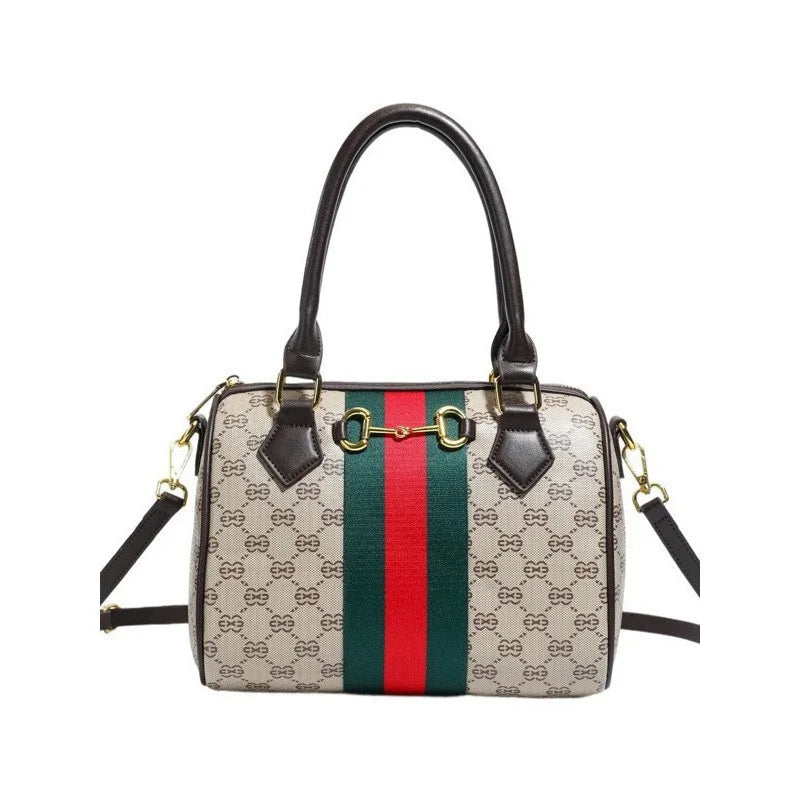 A beige and green patterned leather tote bag with a brown strap.