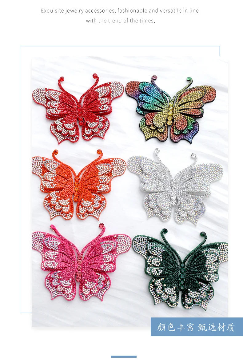 A collection of five decorative rhinestone butterfly appliqués or stickers in various colors like red, orange, pink, and gree