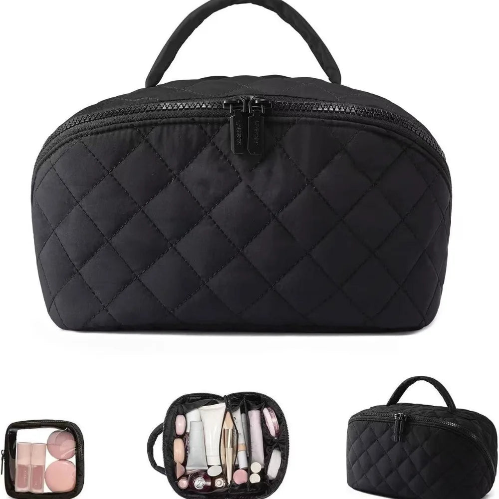 Black quilted lay-flat water-resistant makeup organizer bag with a top handle