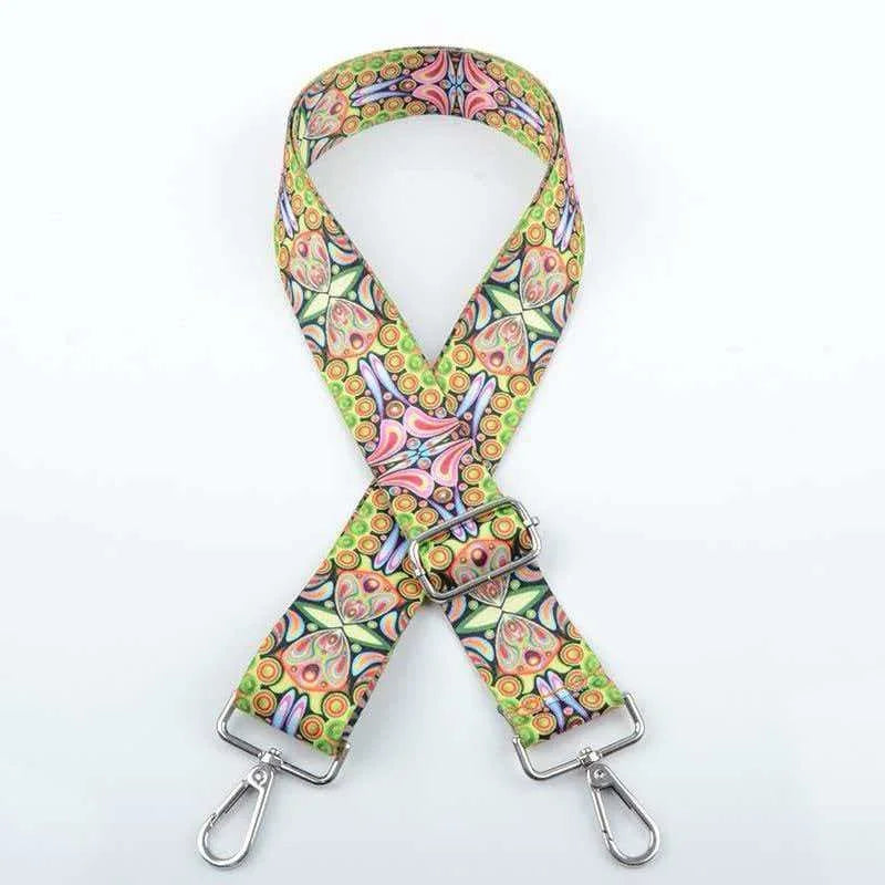 A patterned, adjustable crossbody strap featuring floral and geometric designs.