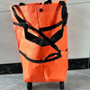 Orange foldable lightweight shopping cart with black straps and wheels