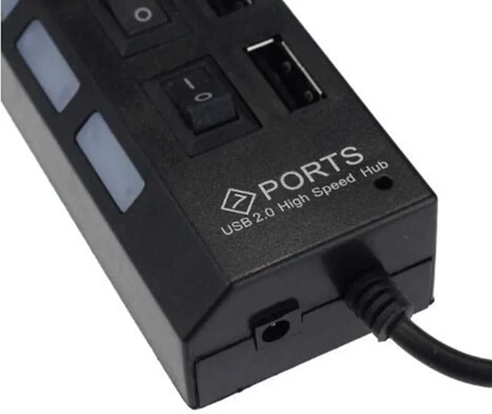 A black 7-port USB 2.0 high-speed hub with on/off switches and a cable connector.