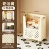 A white U-shaped foldable laundry basket with handles is shown, featuring a grid pattern and wheels for easy movement.