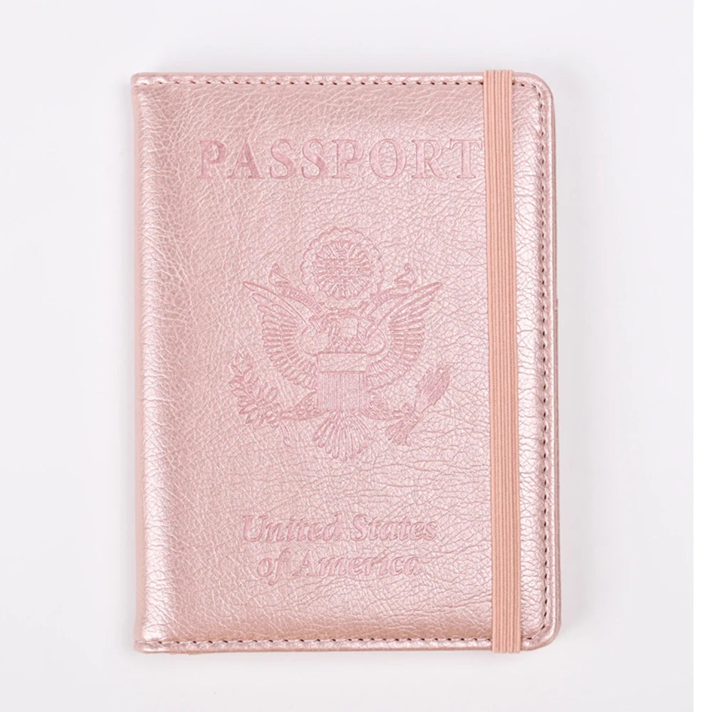 A pink leather passport holder with embossed eagle design and United States of America text.