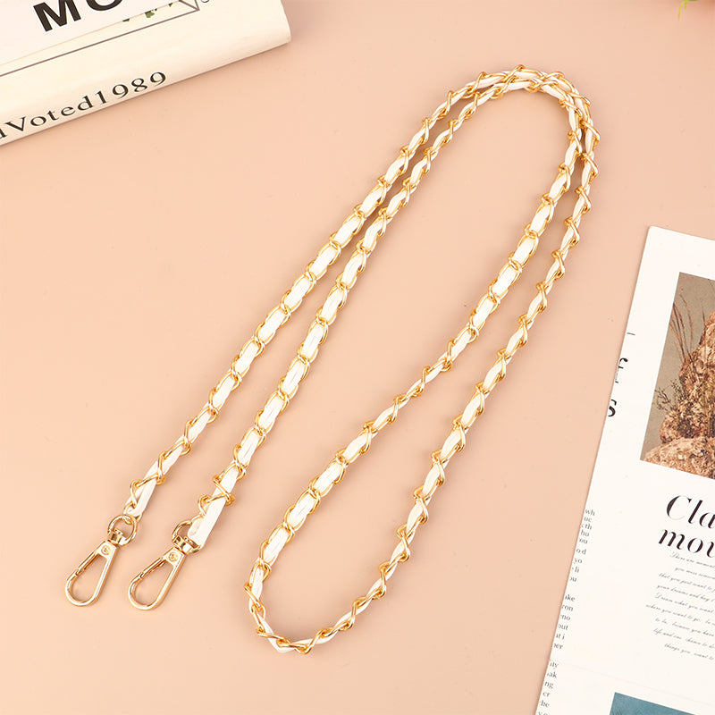 Gold-toned leather chain strap for an adjustable crossbody purse.