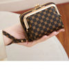 A black fashion print accordion card holder wallet shown in various angles and configurations.