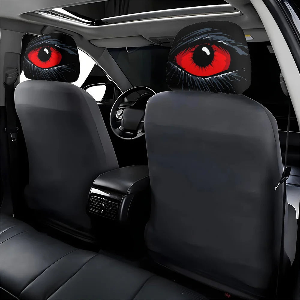 Set of two black car headrest covers with striking red and black devil eye designs.