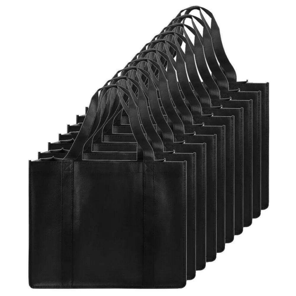 A stack of black reusable eco-friendly tote bags for grocery shopping