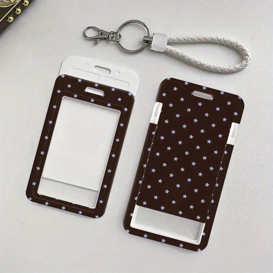 A dark brown card holder with a star pattern and a white insert is shown next to a silver retractable lanyard.