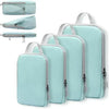 A set of four light blue travel compression packing cubes shown in various folded and open configurations.