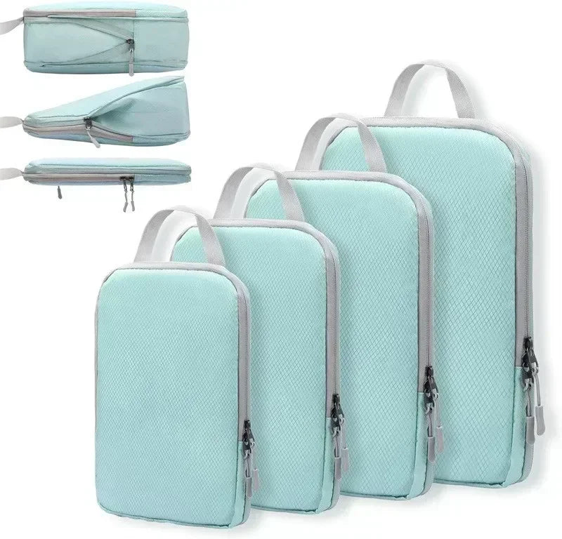 A set of four light blue travel compression packing cubes shown in various folded and open configurations.