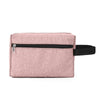 A pink fabric cosmetic bag with a black zipper and black trim.