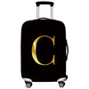 Black rolling suitcase with a gold letter C design.