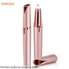 A pink precision electric eyebrow scraping knife with a protective cap and a separate scraping tool.