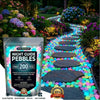 A bag of multicolor glow-in-the-dark solar pebbles used for outdoor garden and pathway decoration.