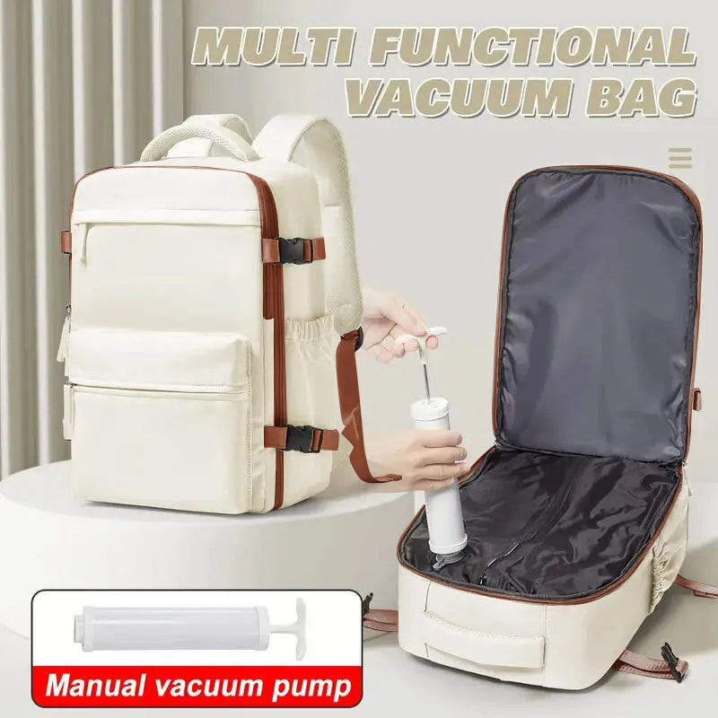 A cream-colored multi-functional vacuum bag travel backpack with an attached manual vacuum pump.