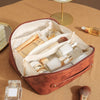 A vintage floral waterproof makeup tote bag is open, revealing various cosmetic products inside on a tan surface.
