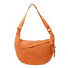A tan canvas crossbody shoulder bag with a drawstring closure.
