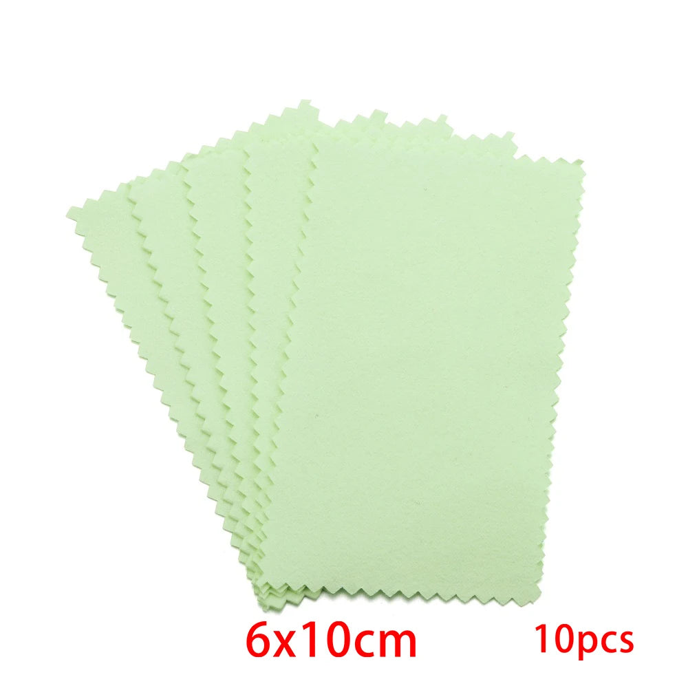 A set of ten light green polishing cloths with serrated edges.