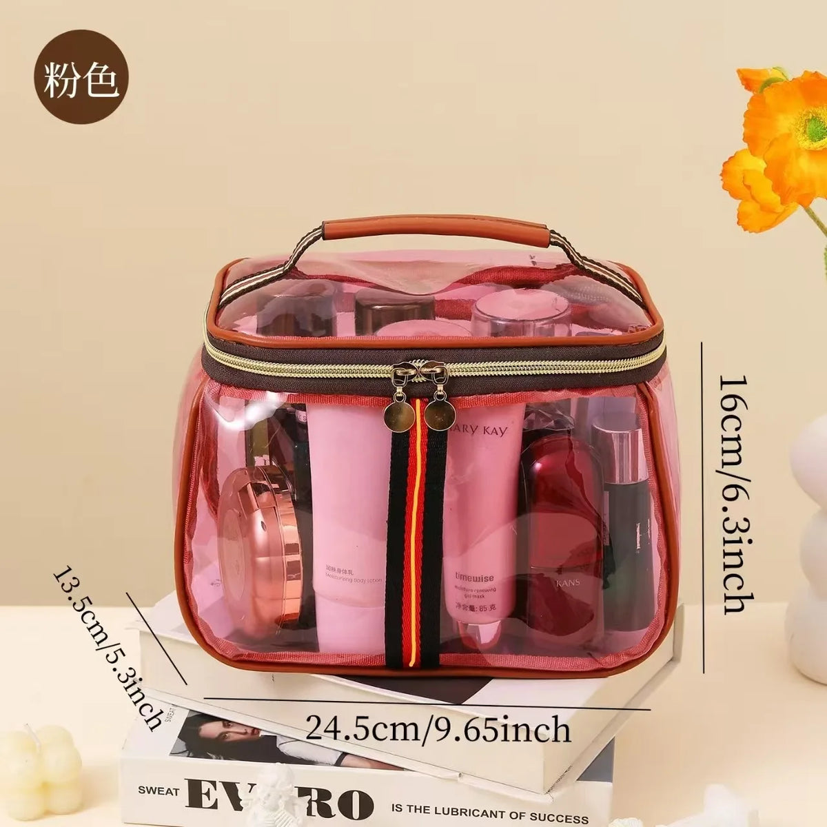 A clear pink waterproof travel toiletry bag containing various grooming products like brushes and bottles.