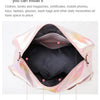 Pink iridescent nylon travel bag showing interior compartments for various daily necessities