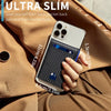 A hand holds an Ultra Slim phone case featuring a carbon fiber back and blue ID window, placed against a brown jacket.