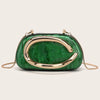 An elegant gold-tone evening clutch bag with a vibrant green marbled finish.