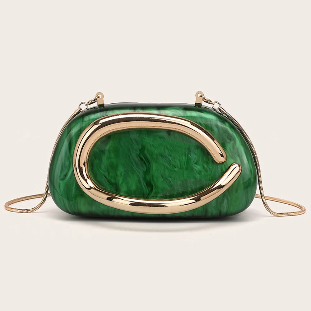 An elegant gold-tone evening clutch bag with a vibrant green marbled finish.