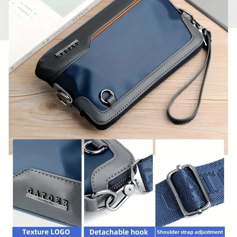 A dark blue leather crossbody bag with a black adjustable strap and silver hardware.