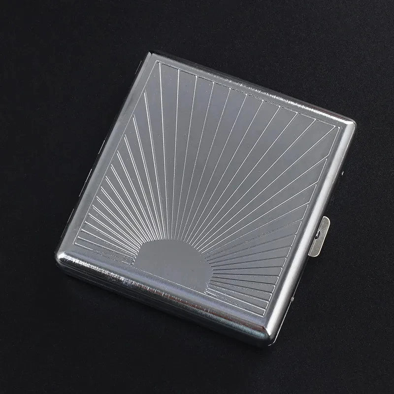 A rectangular silver metal cigarette storage box with radiating lines on the lid.