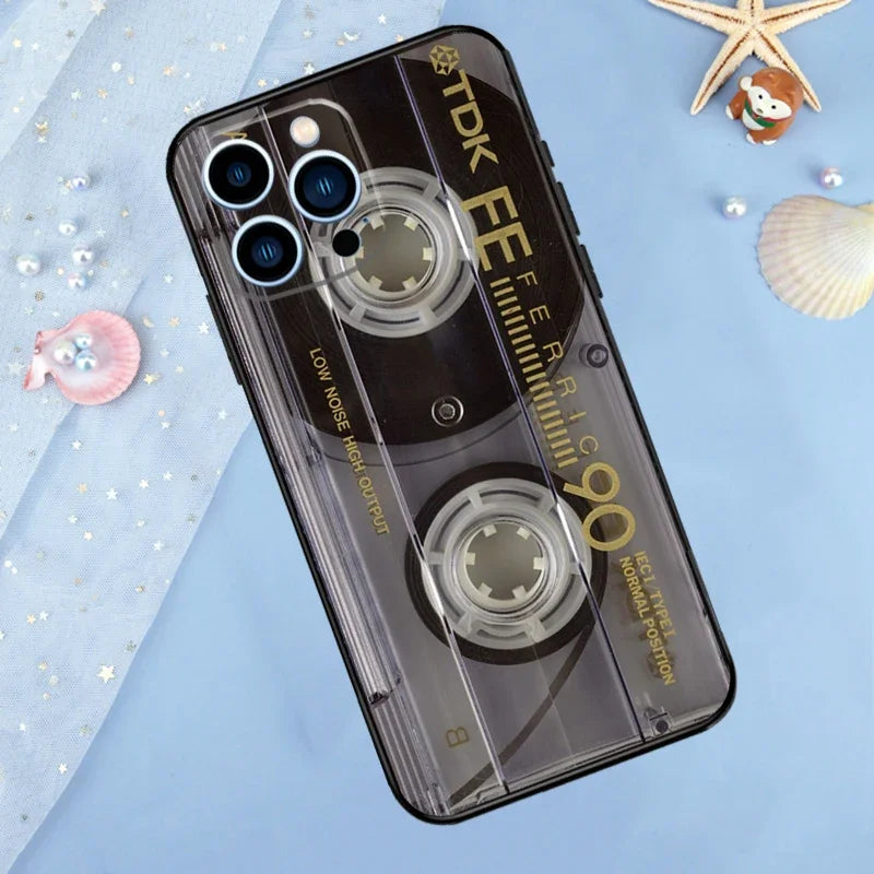 A clear phone case with a vintage cassette tape design featuring multiple camera lenses and text on the back
