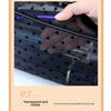 A hand is holding a black mesh transparent makeup storage bag, showing the visible mesh material.