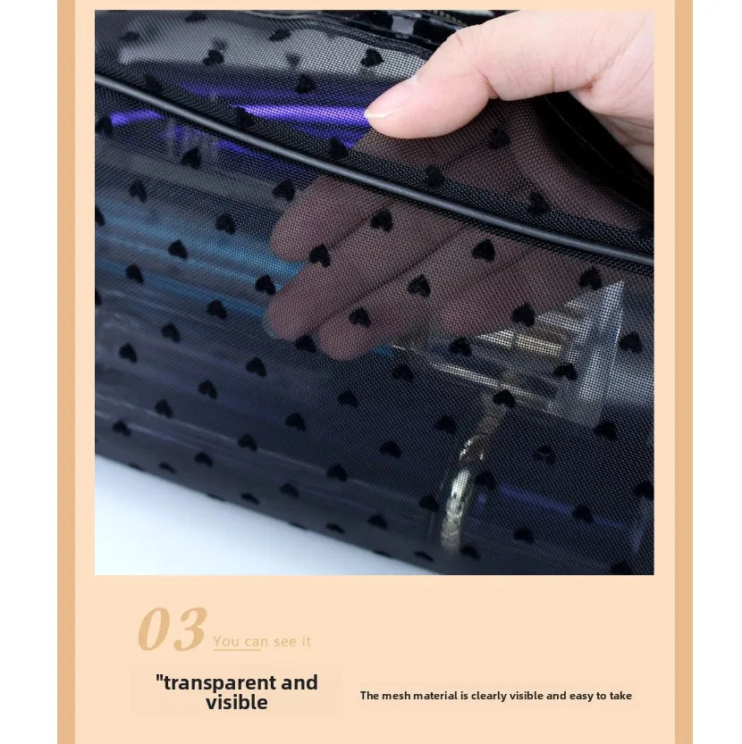 A hand is holding a black mesh transparent makeup storage bag, showing the visible mesh material.