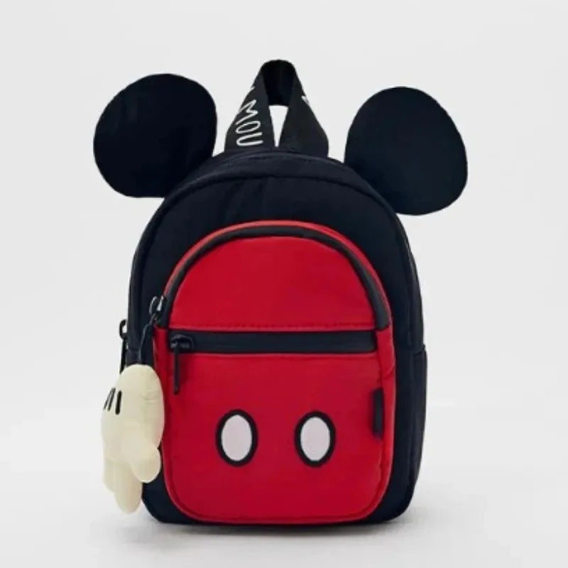 A red backpack featuring a cow print design and white accents.