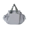 A light gray nylon shoulder bag with a flap closure and patterned strap is shown against a white background.