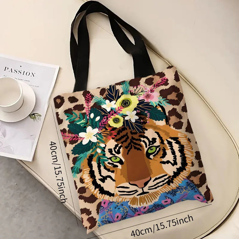A canvas tote bag featuring a leopard print background with an illustration of a tiger wreath.