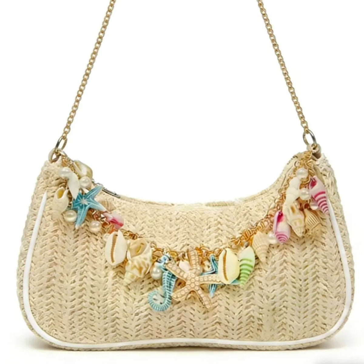 A beige straw shoulder bag adorned with colorful sea charms and woven texture.