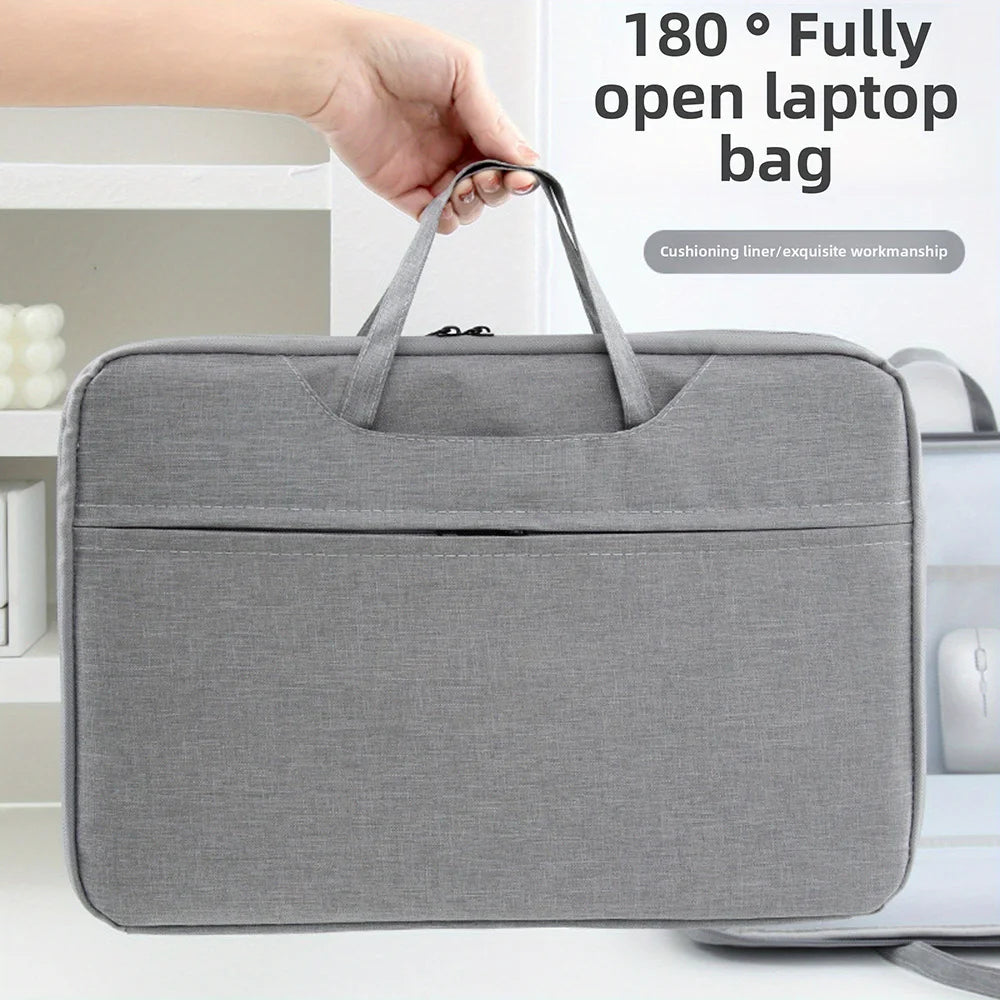 A gray laptop bag is shown open, demonstrating its 180-degree fully open feature.