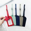 Five colored PU leather luggage tags with names and addresses are displayed on a white surface.
