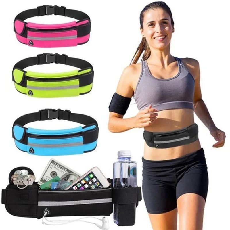 A woman wearing a black running top and shorts demonstrates a waterproof running waist pack with a phone pocket.