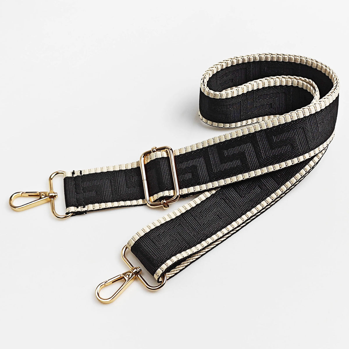 Black and gold patterned adjustable crossbody bag strap featuring a maze design