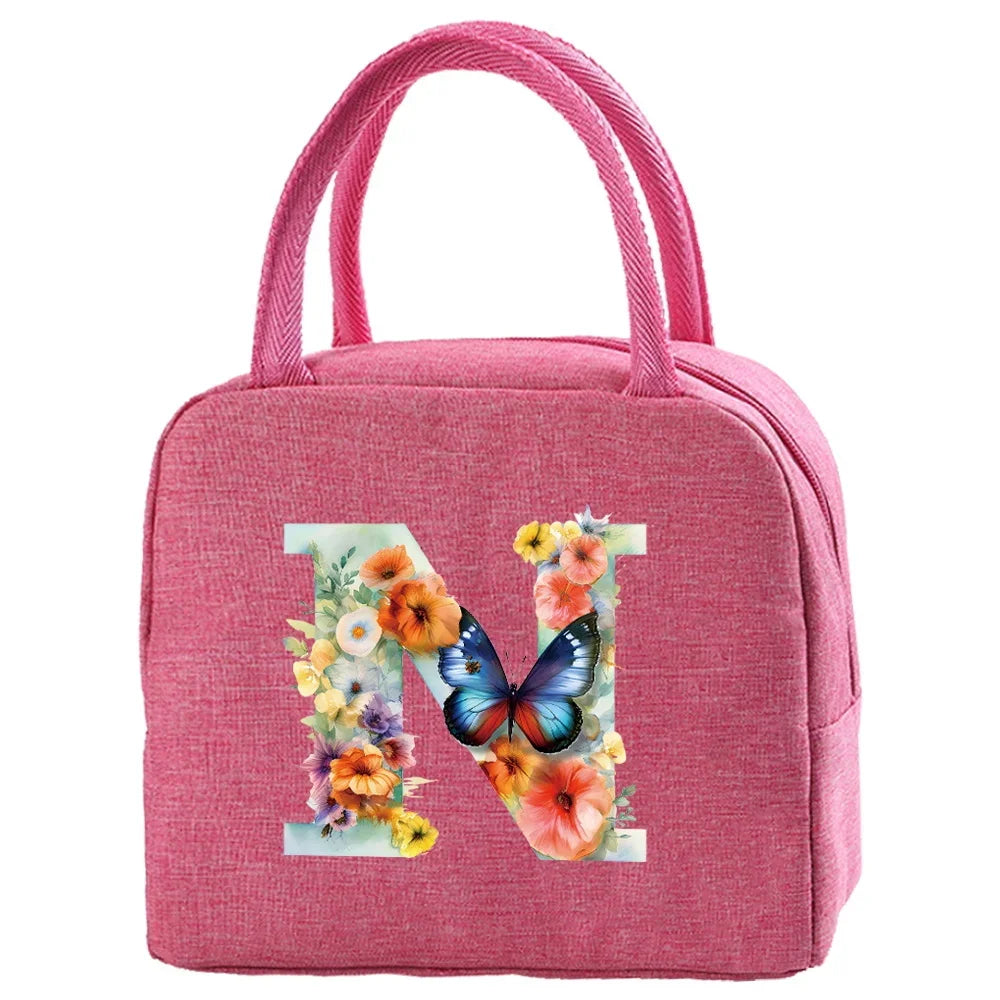 Pink insulated canvas lunch bag featuring a large letter N design.