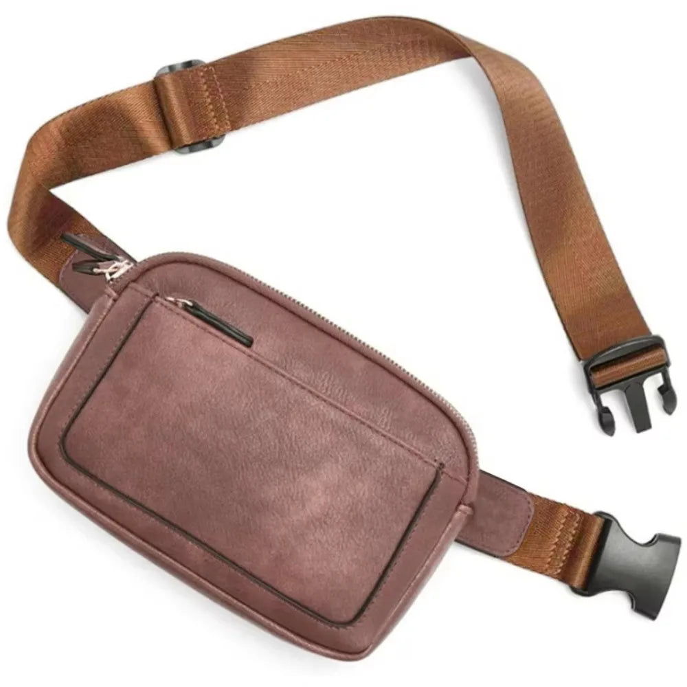A brown PU leather crossbody waist bag with a leather strap shown against a white background.