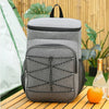 A gray insulated lunch backpack with a black Oxford shell is placed on a wooden surface outdoors.