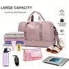 A large pink expandable nylon travel duffle bag is shown with various toiletries and a portable charger.