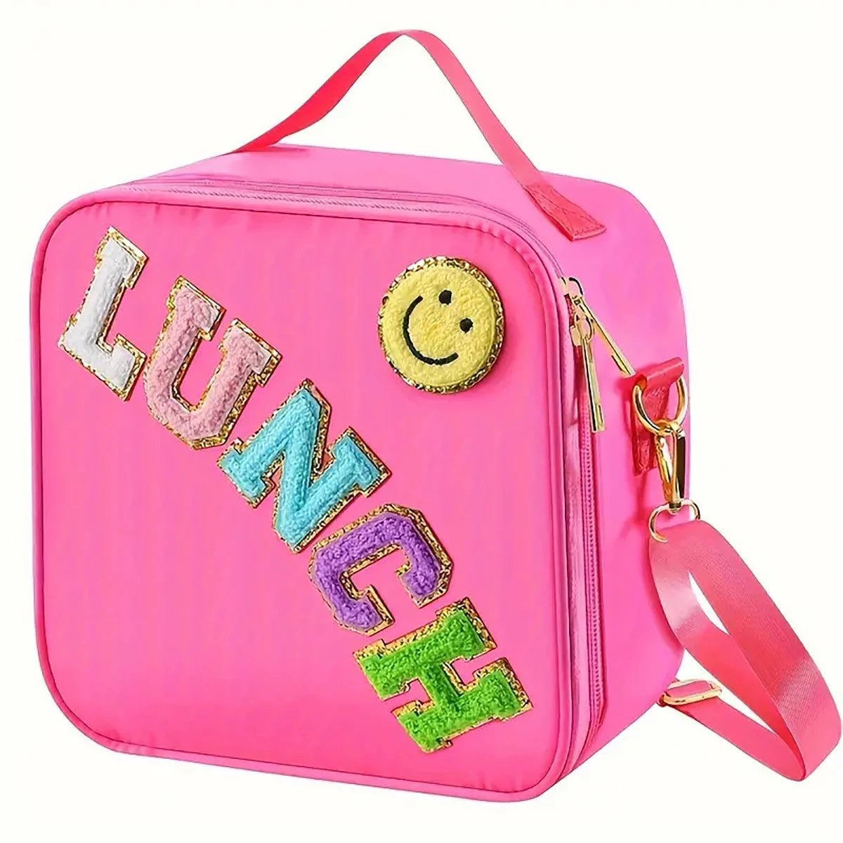 Pink insulated lunch bag with a smiley face patch and adjustable strap