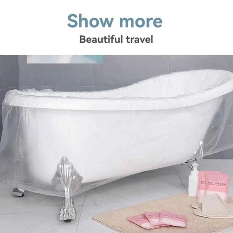 A white disposable bathtub liner set is displayed on a tile surface with pink tissue paper nearby.