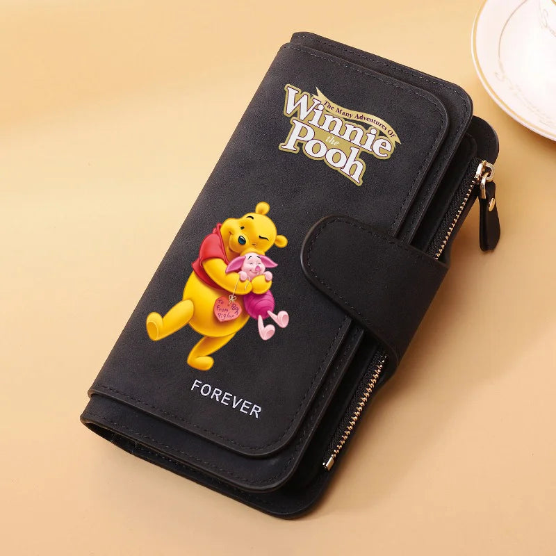 A black zippered pouch featuring Winnie the Pooh and the word Forever